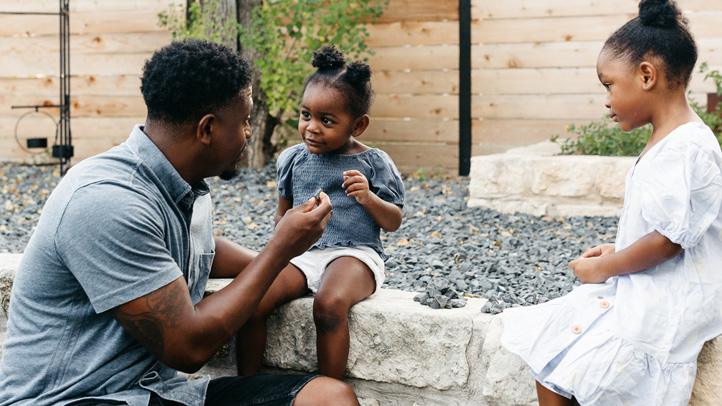 father talking to two toddler girls, how to handle rude behavior in toddlers