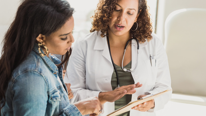 STDs during pregnancy, woman consulting with her doctor